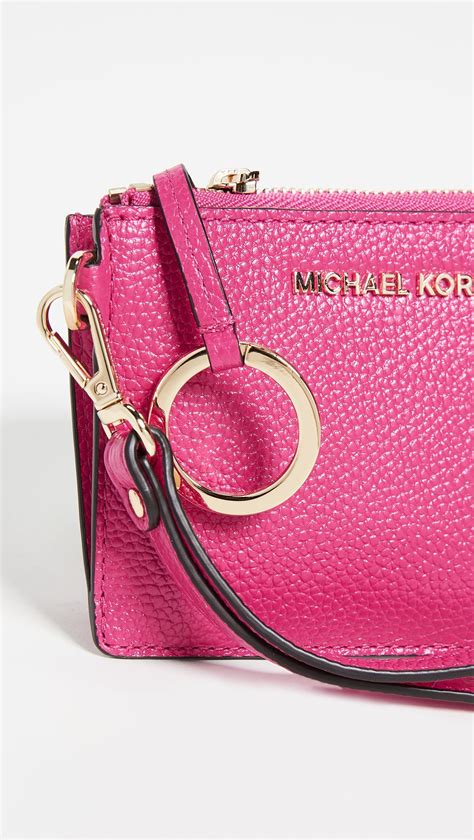 small pink michael kors purse.